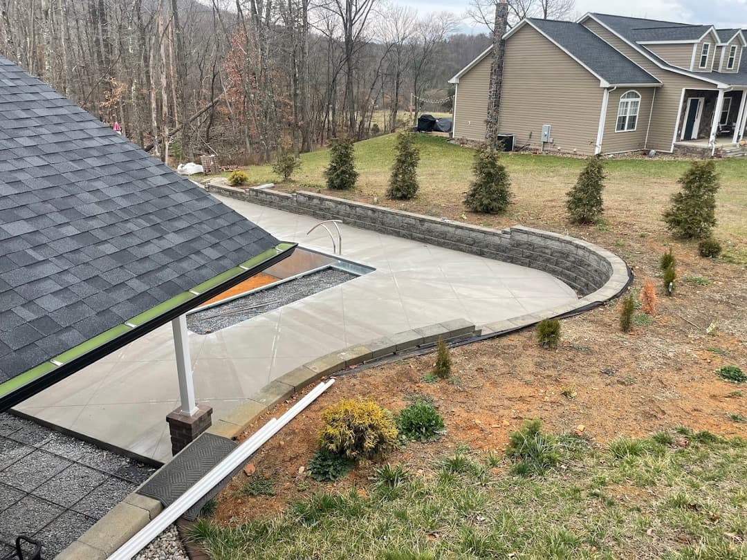Finished concrete patio and retaining wall with pool, Roanoke